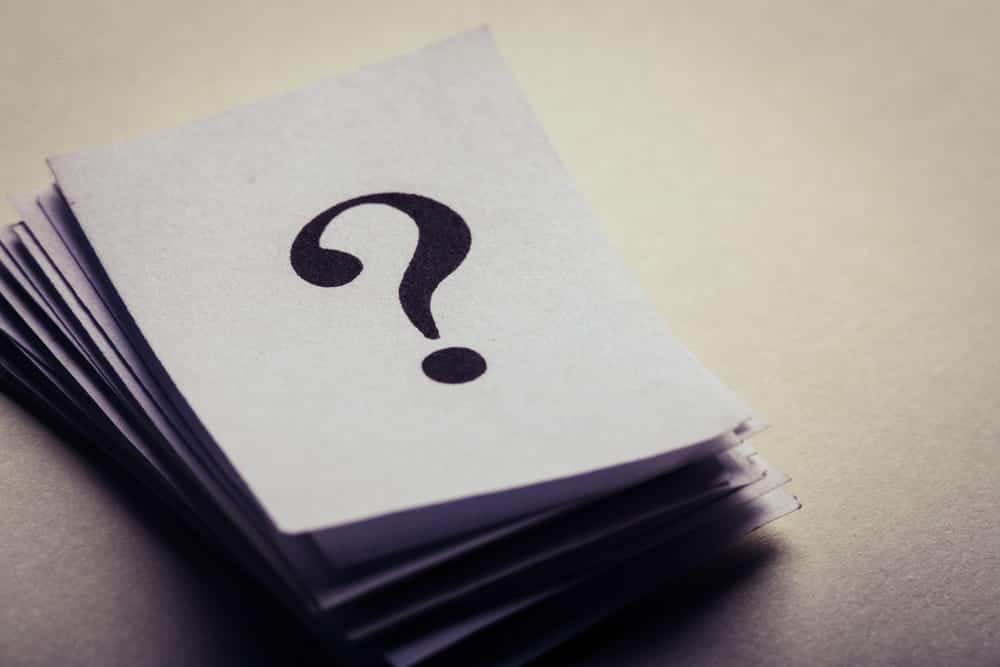 Image is of a stack of papers with a question mark symbol, concept of a DUI lawyer addressing legal questions and uncertainties