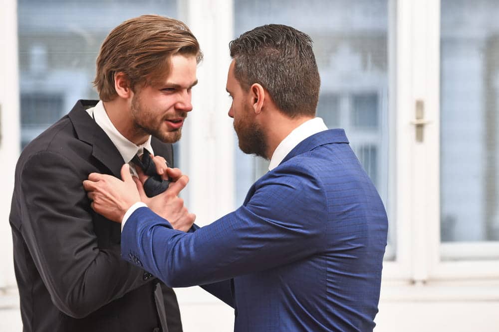 Image is of two individuals in a physical confrontation, concept of violent crimes lawyer handling assault-related cases