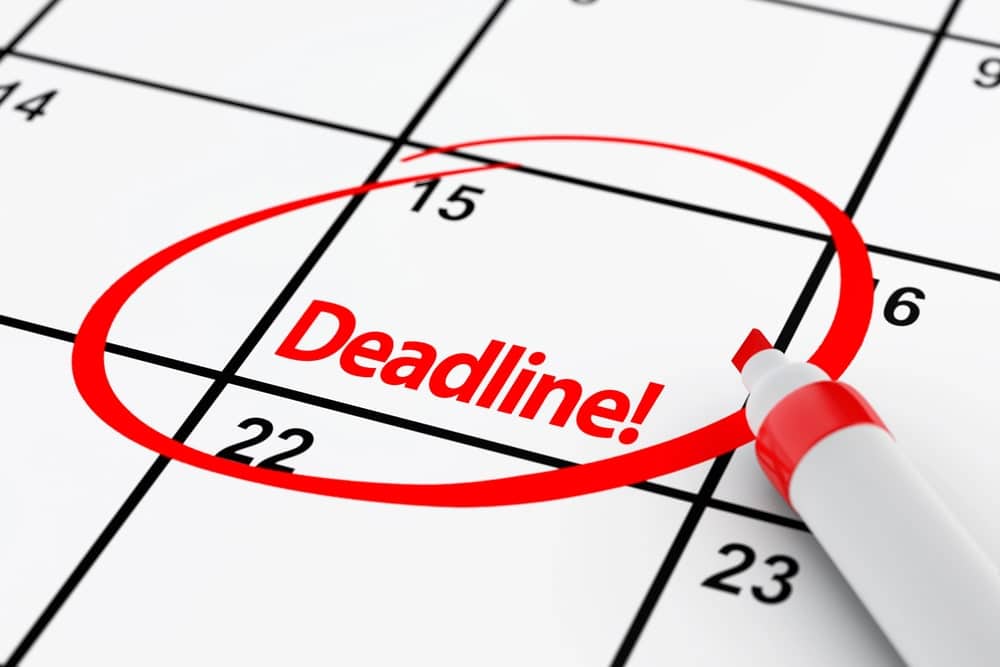 Image is of a calendar with an important deadline circled in red, concept of arrest in Clinton and the importance of responding to court dates and legal deadlines quickly.