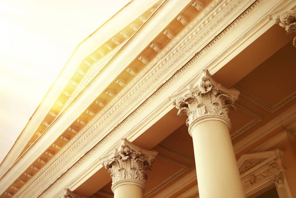 Image is of courthouse columns and a government building exterior, concept of a DUI becoming a felony in Tennessee