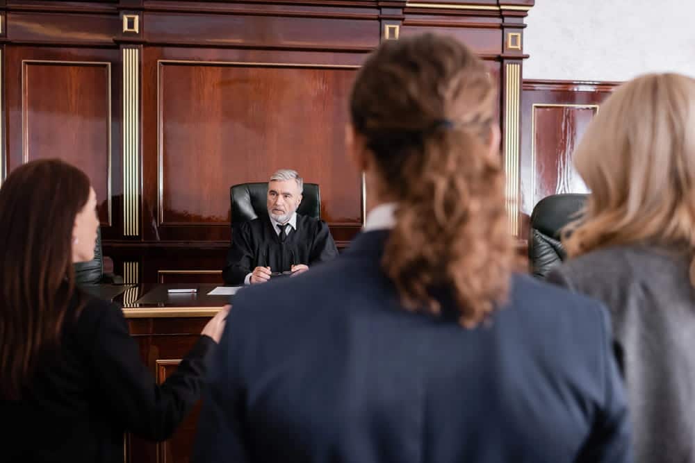 Image is of a judge addressing people in a courtroom during proceedings related to a Tennessee drug case.