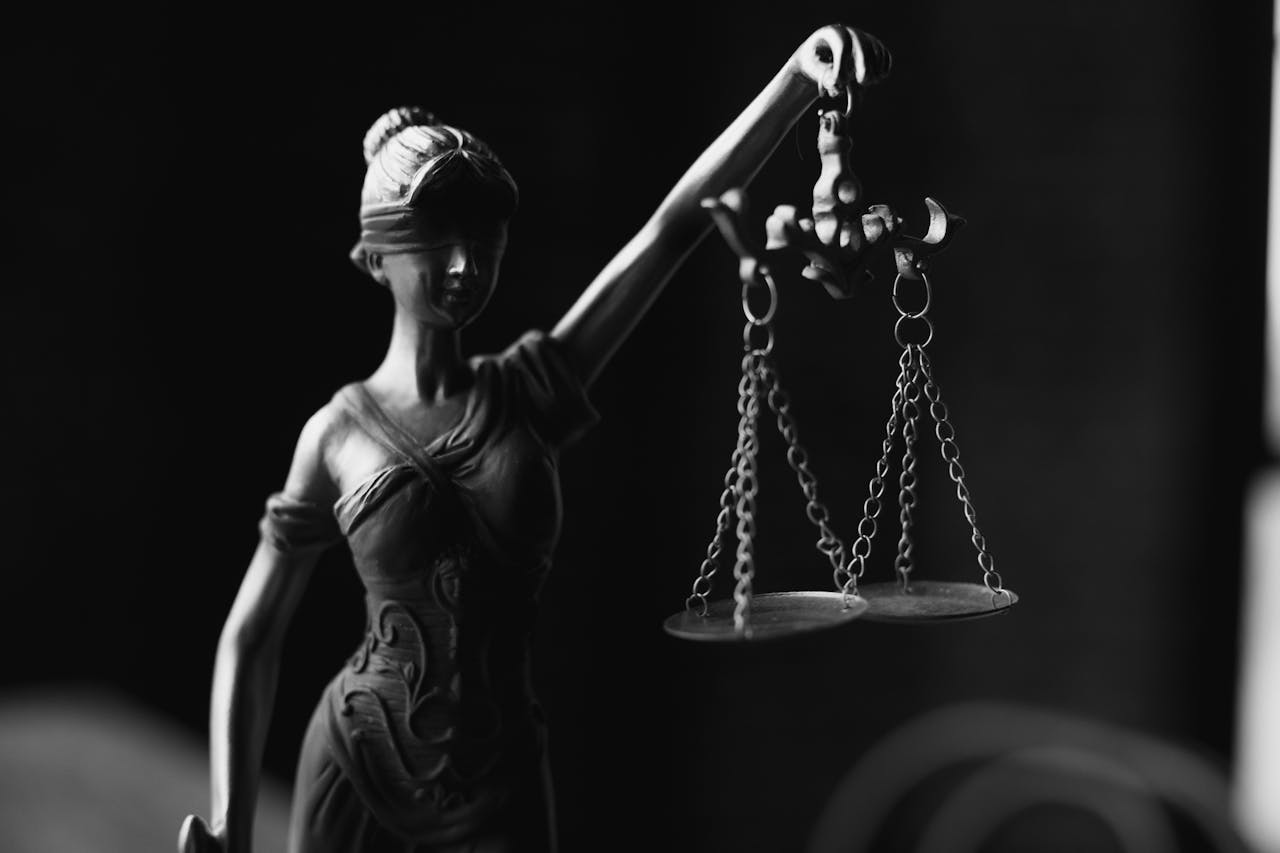 Image is of Lady Justice holding scales, representing the legal process involved in a Tennessee drug case.